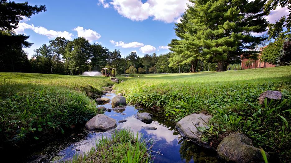 View of 火博体育大学 landscape from a stream on campus